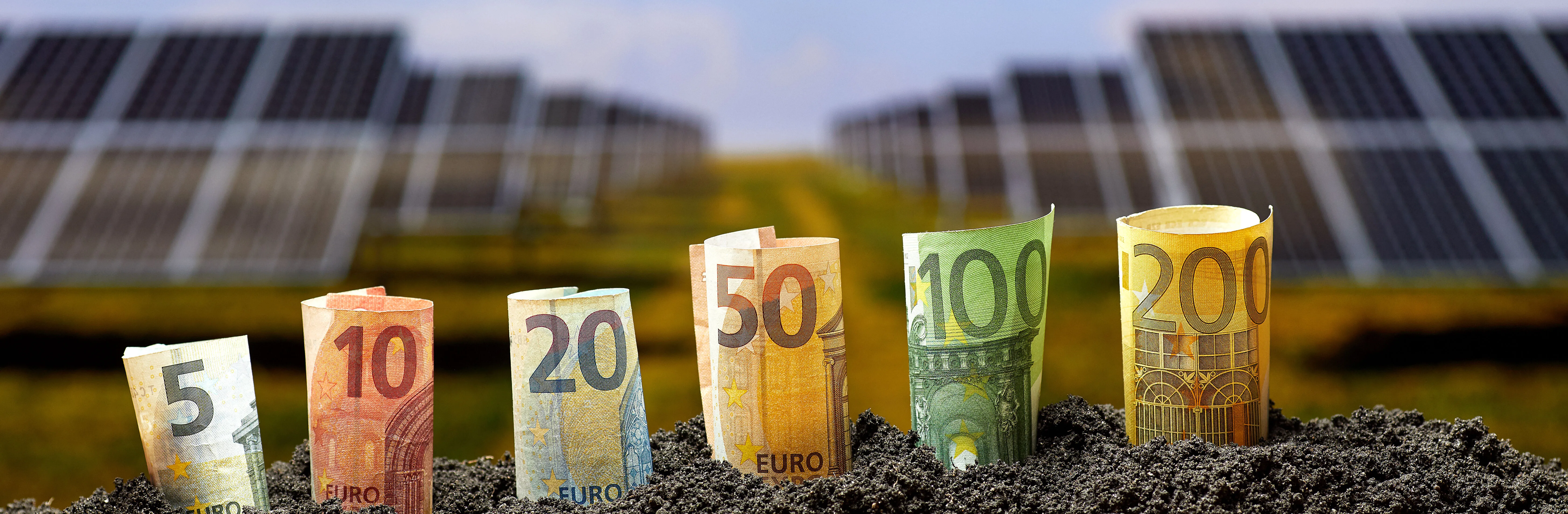 Euro banknote and solar panels on background, alternative electricity source. Sustainable resources concept.jpg